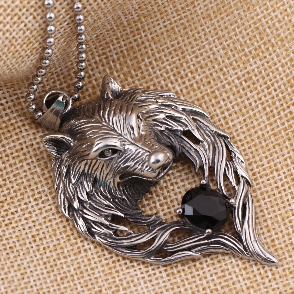 Vintage silver metal wolf head gothic pendant on bead chain front flat lay view showing complete wolf face display