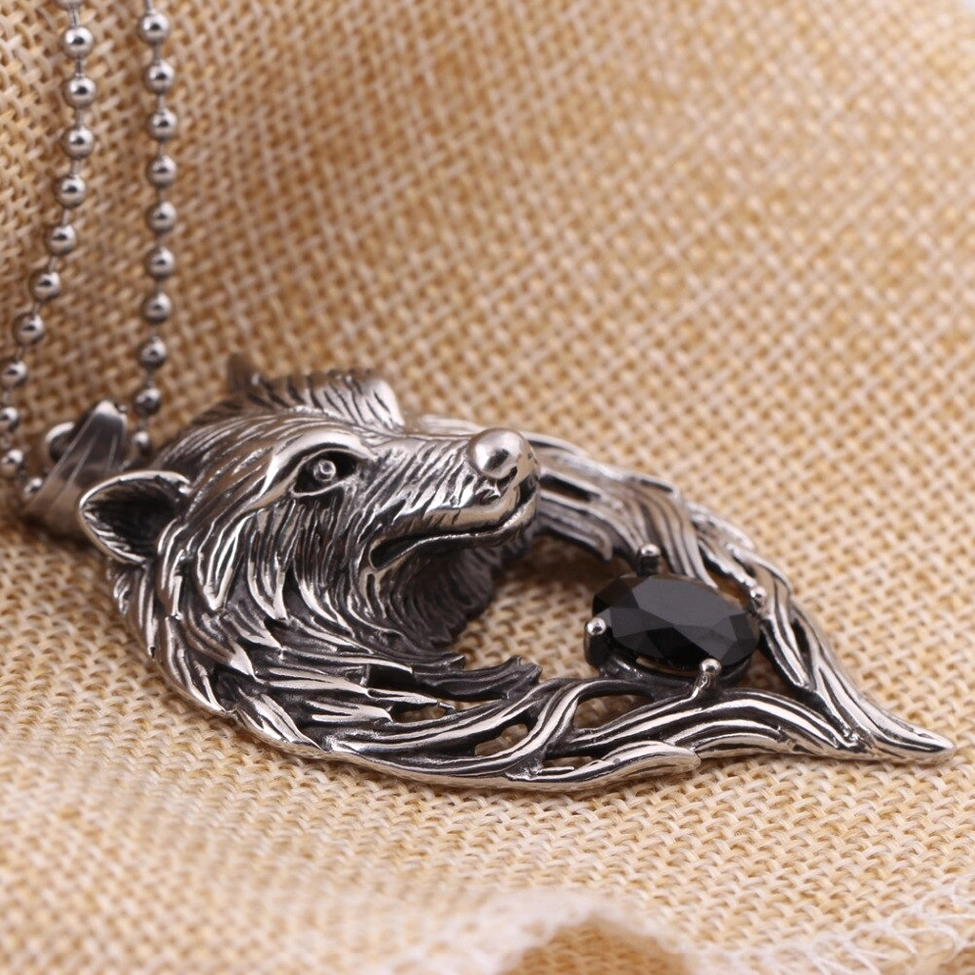 Stainless steel wolf head pendant on ball bead chain profile flat lay showing crystal inlay and chain details