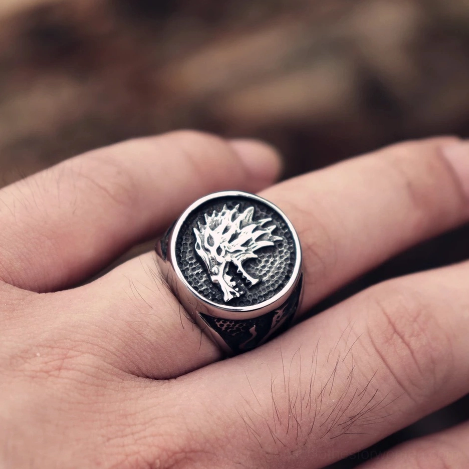 Wolf head gothic ring worn on finger close-up side view dark vintage finish
