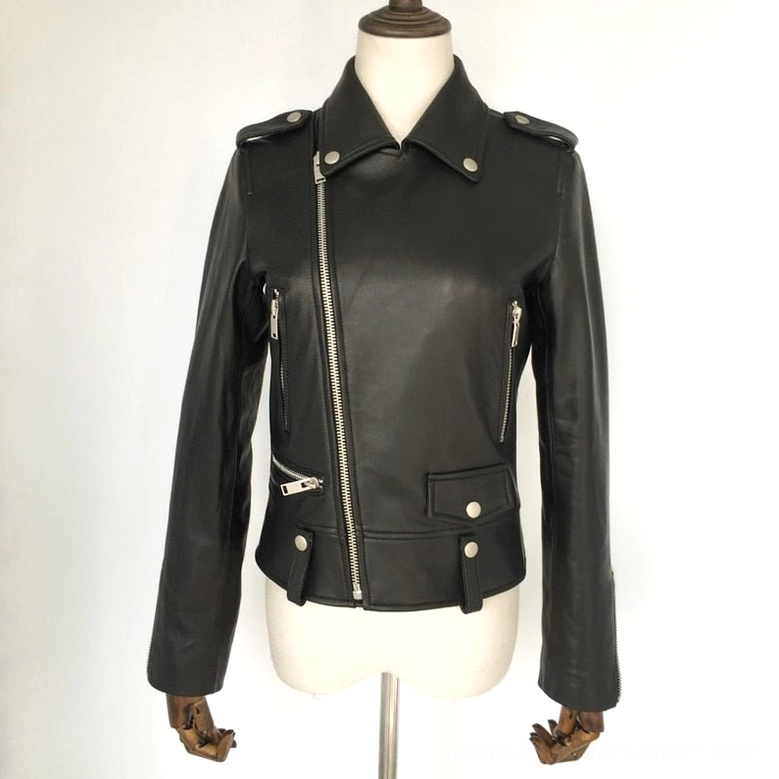 Women's black leather motorcycle jacket full front view on mannequin, highlighting zippered cuffs, slim fit silhouette, and silver metal accents