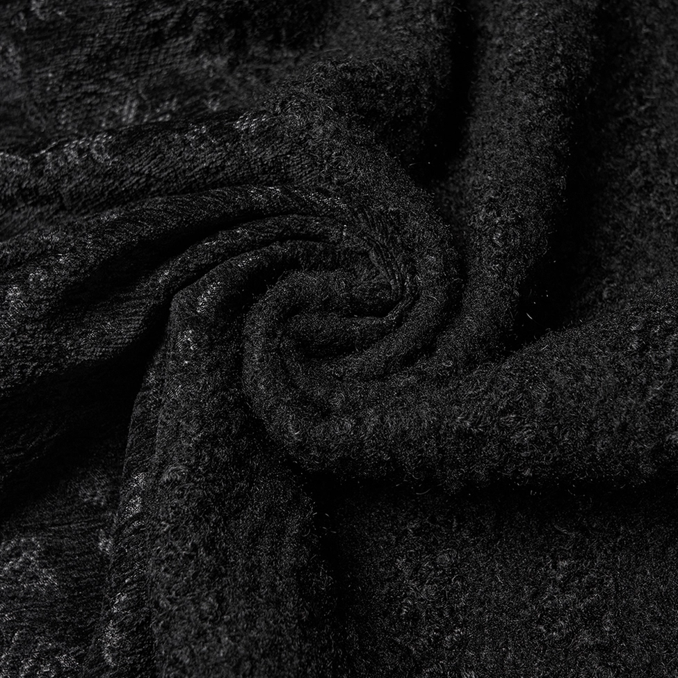 Black gothic wool coat detail highlighting hem construction, A-line silhouette flare, and interior satin lining quality