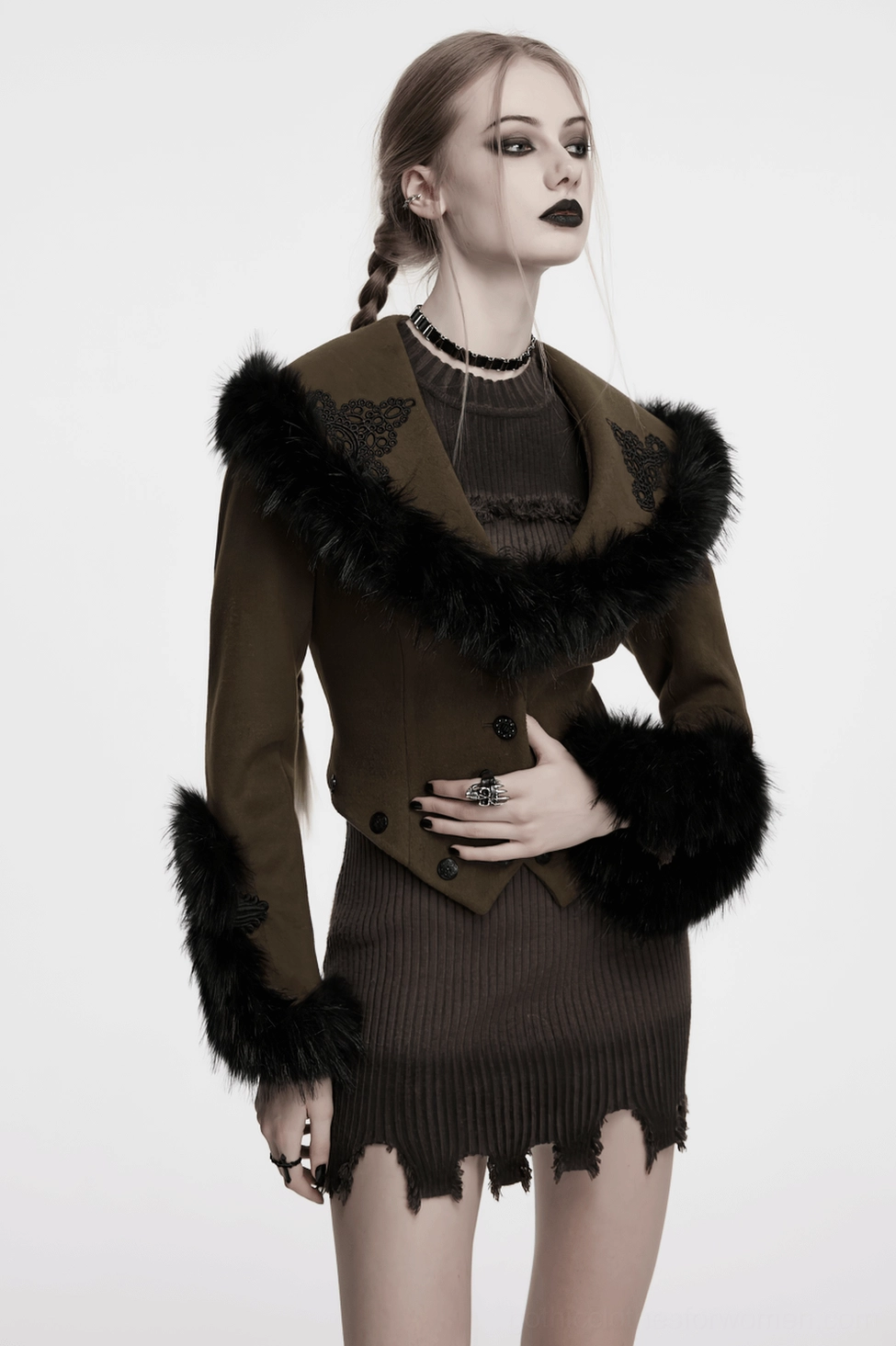 Texture detail photograph of premium wool fabric and handmade buckle on gothic coat cuff