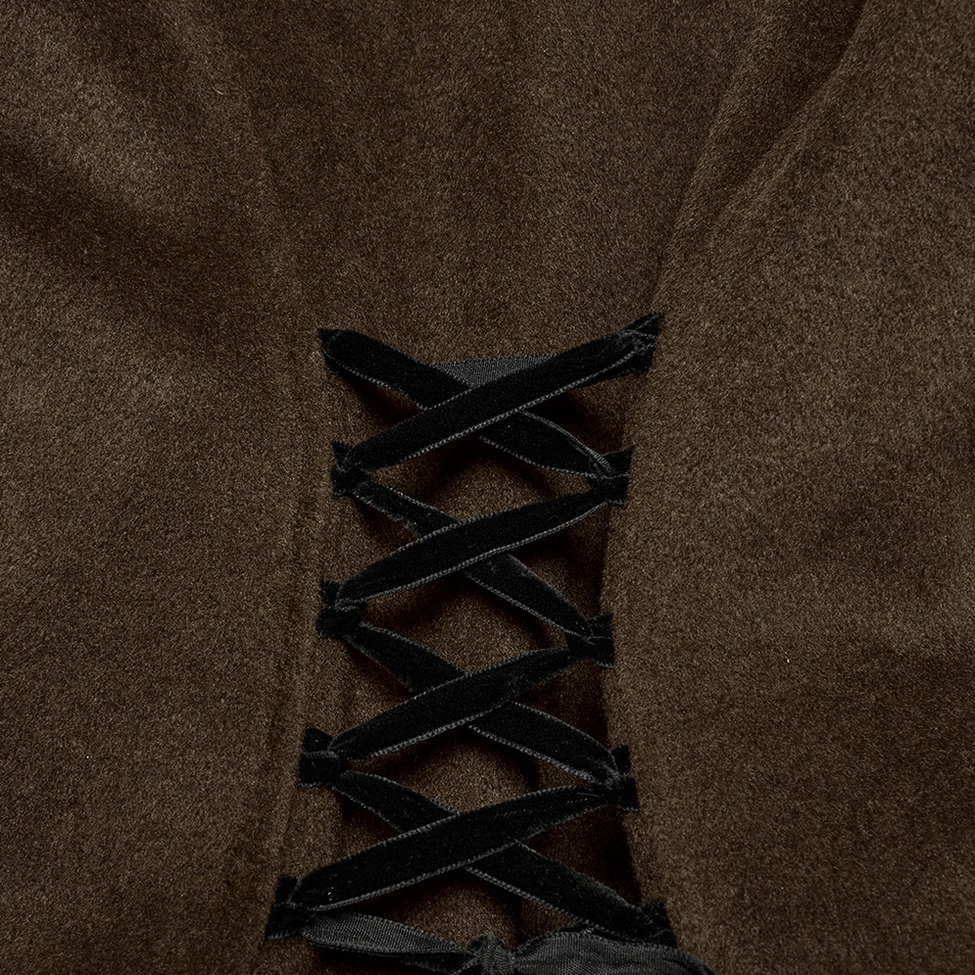 Product styling shot of gothic wool coat with accessories showing alternative fashion styling