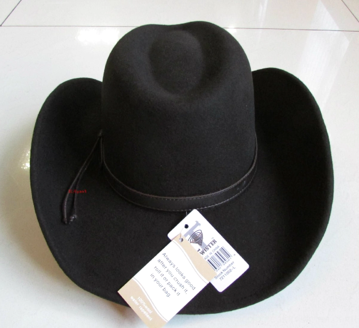 Gothic black fedora right three-quarter angle on tiled background, showcasing plain leather hat band and soft wool texture for dark aesthetic