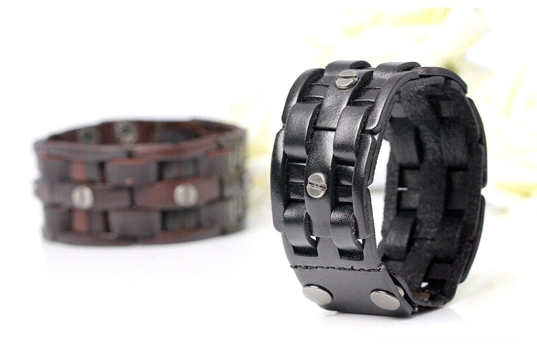 Two leather gothic wrap bracelets in black and brown, front oblique view with white flowers, showing compact woven design and adjustable clasp