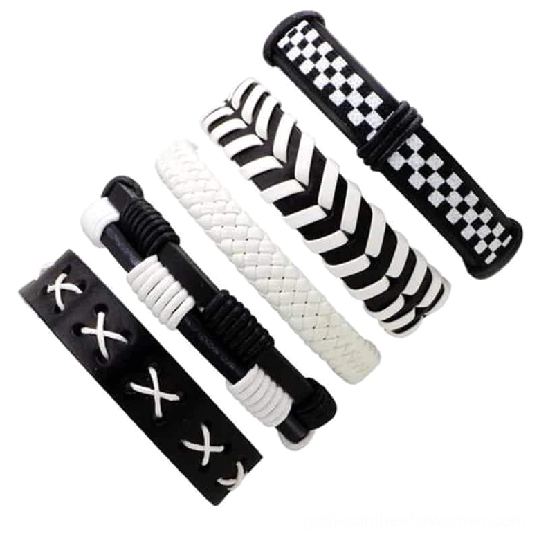 Black and white punk style leather wristbands featuring cross-stitch, chevron and checkerboard patterns side view detail