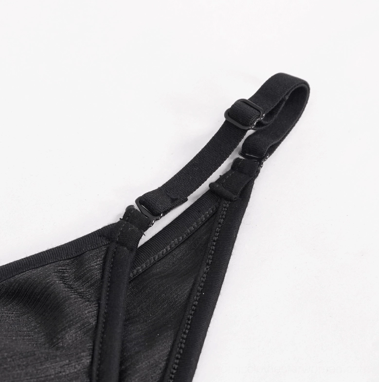 Black mesh cutout gothic one-piece swimsuit close-up detail view of fabric texture and mesh panels
