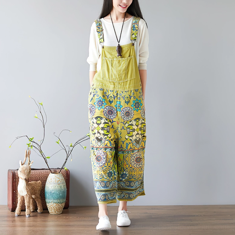 Olive green ethnic floral print wide-leg gothic pants full side shot with home decor props