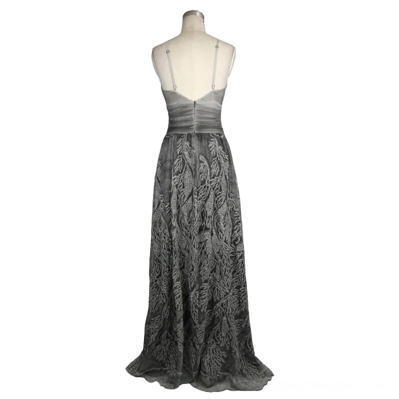 Grey backless evening dress rear view on dress form showing low back spaghetti straps and leaf print