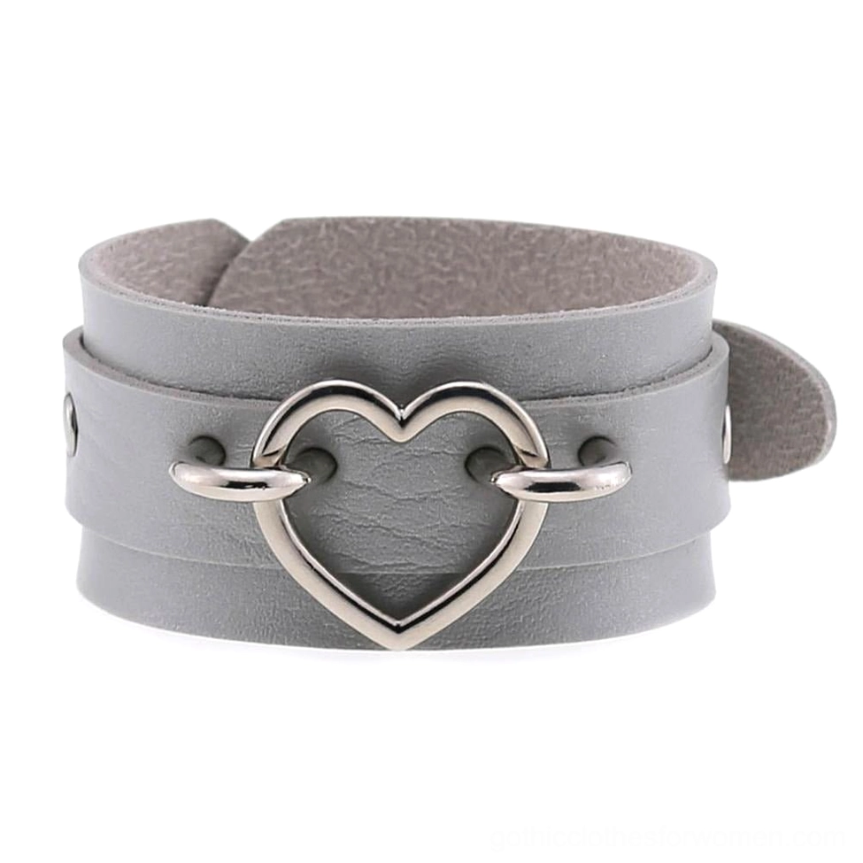 Grey leather single-strap gothic heart bracelet with small silver heart buckle, side flat view