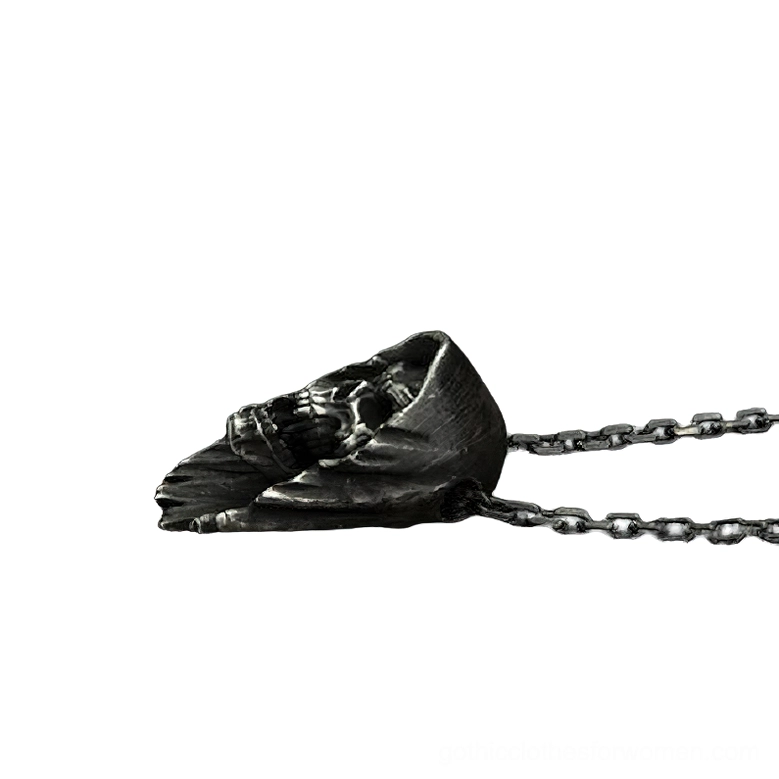 Bottom side view of aged black stainless steel hooded skull pendant on dual curb chains, obscured side perspective