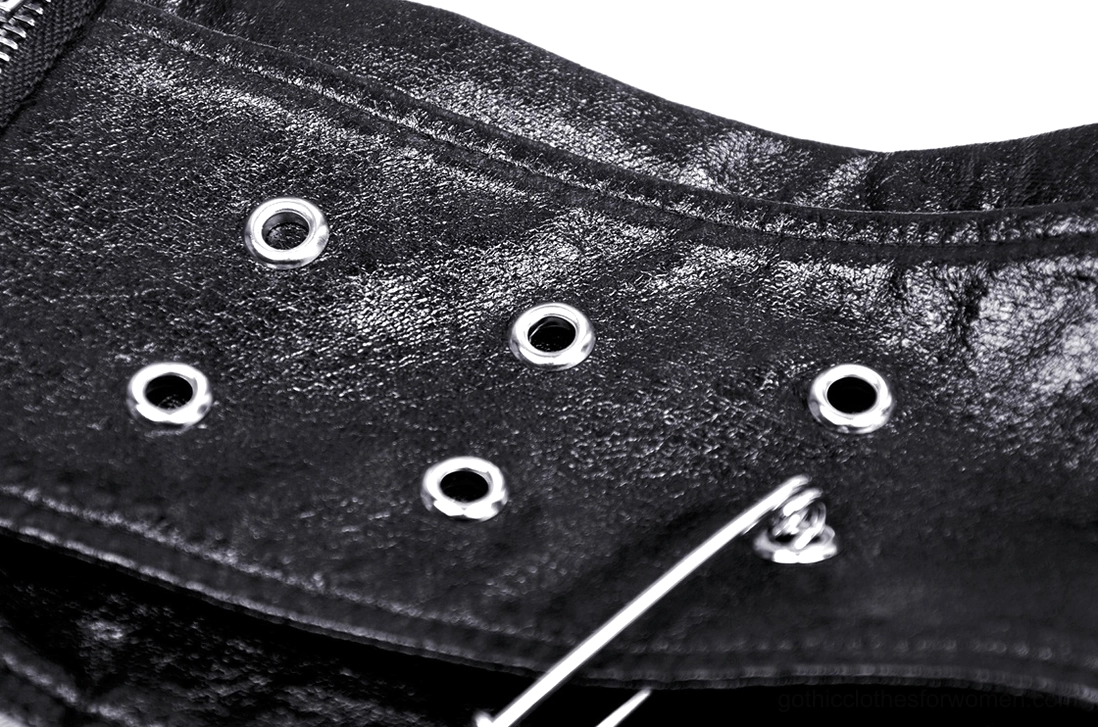 Overhead close-up of gothic plaid skirt leather waistband with grommet holes and safety pin detail
