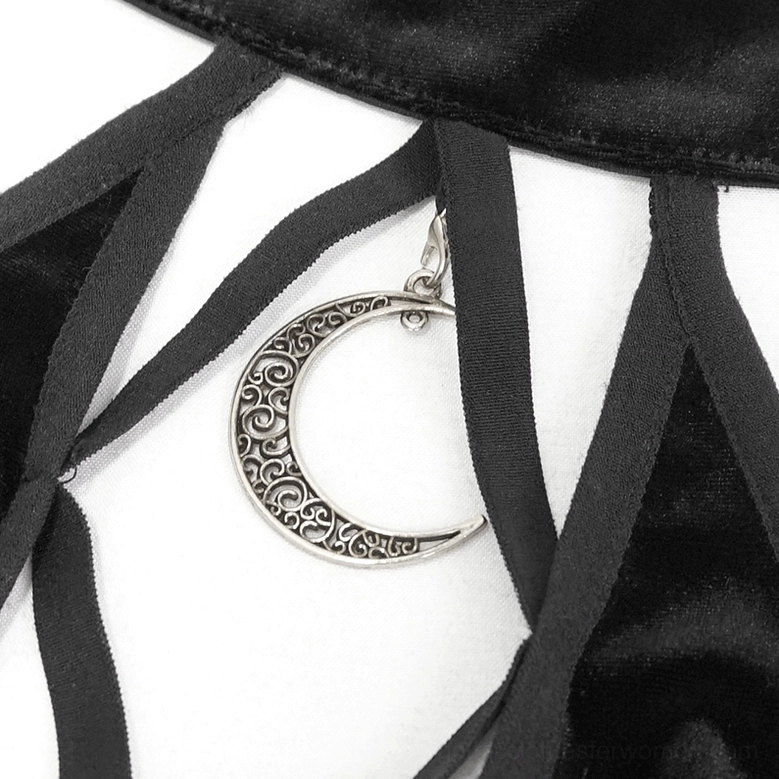 Halter crop top detail shot showing moon charm pendant and velvet fabric quality on mannequin display