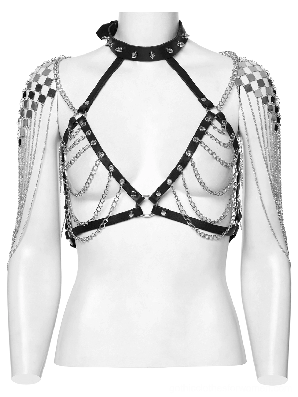 Black punk harness with checkered metal shoulder studs and layered silver chains on mannequin