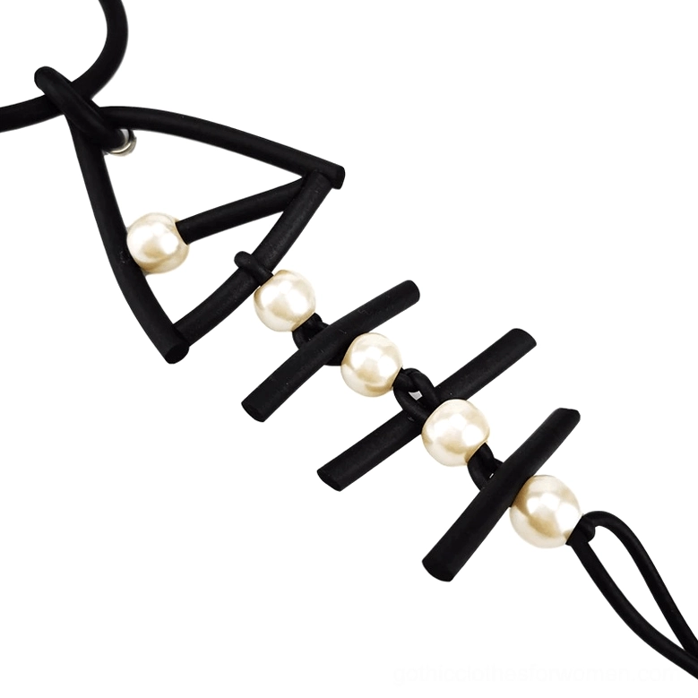 Handmade black rubber fish bone pendant necklace showcasing gothic jewelry craftsmanship and artisanal construction