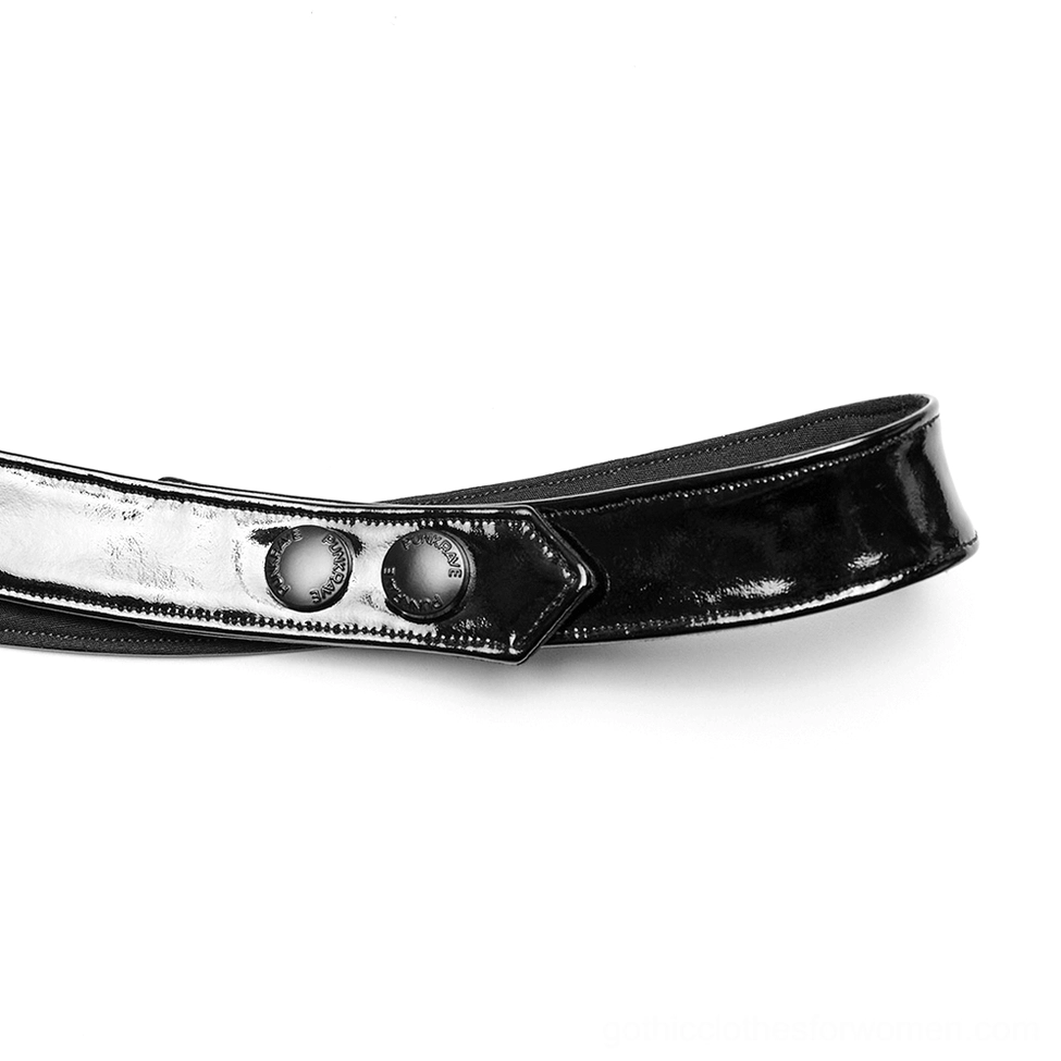 Top-down close-up view of harness adjustment strap with dual snap fasteners for customizable fit