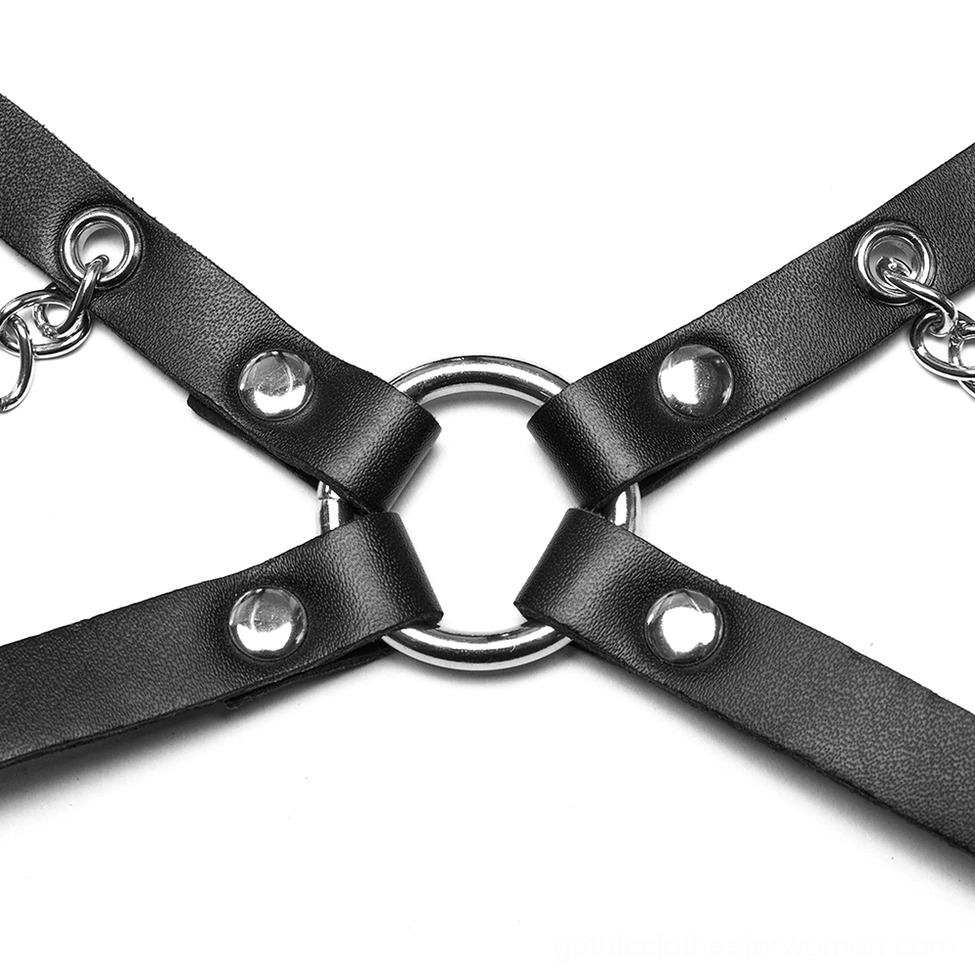 Harness hardware connection point with black leather straps and round metal O-ring attachment