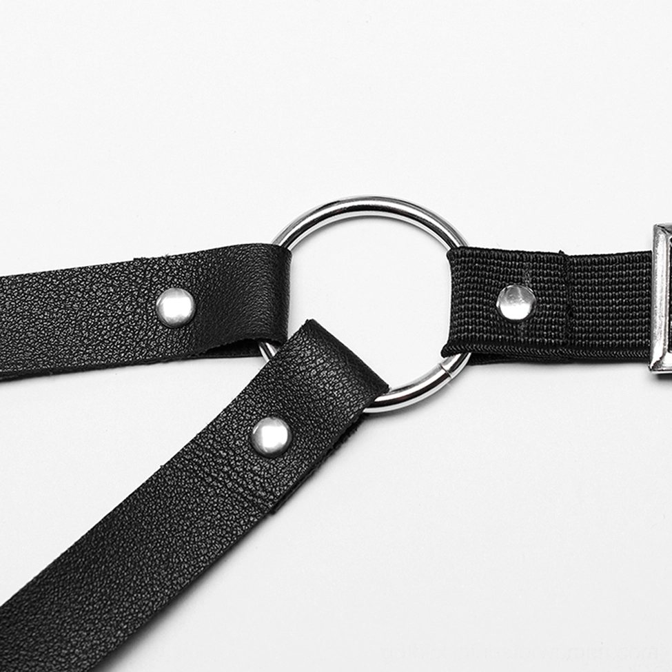 Body harness buckle hardware detail - silver metal buckle on black PU leather strap