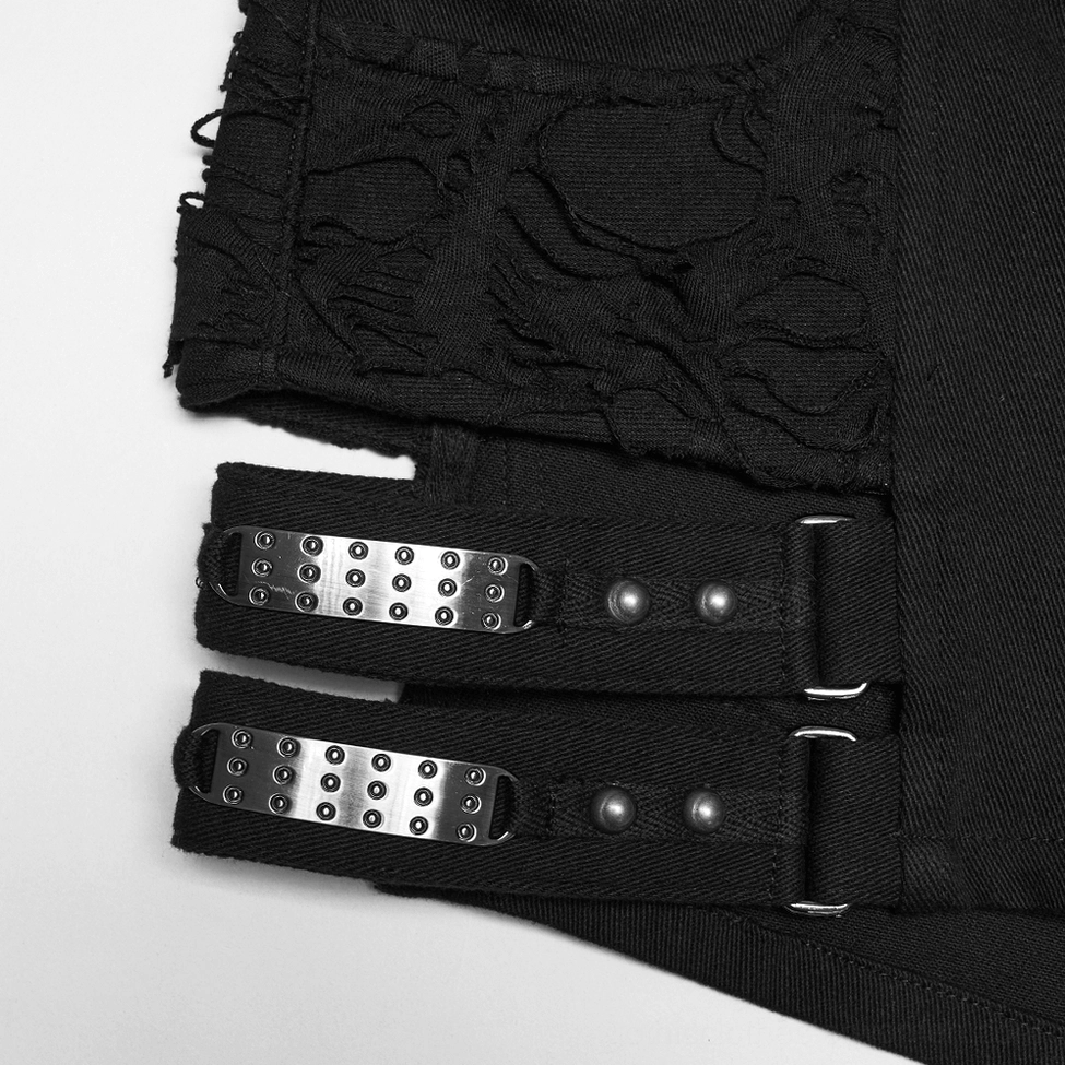 Close-up of metal studded adjustable buckles and black webbing harness straps