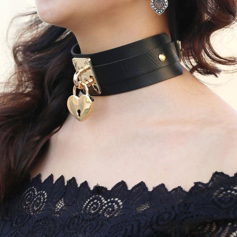 Gothic heart lock choker detail showing silver lock mechanism and leather construction - close-up