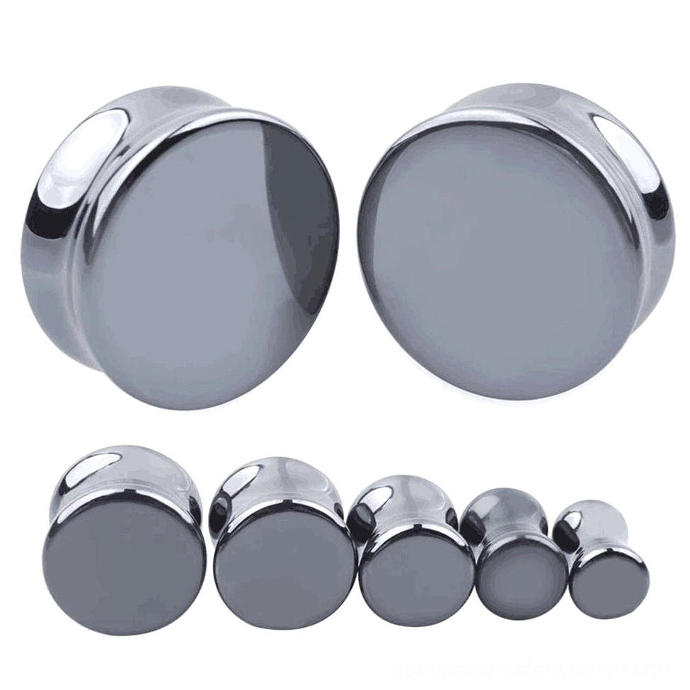Dark gray hematite stone ear gauges and flesh tunnel plugs in various sizes, polished gothic body jewelry displayed on white studio background