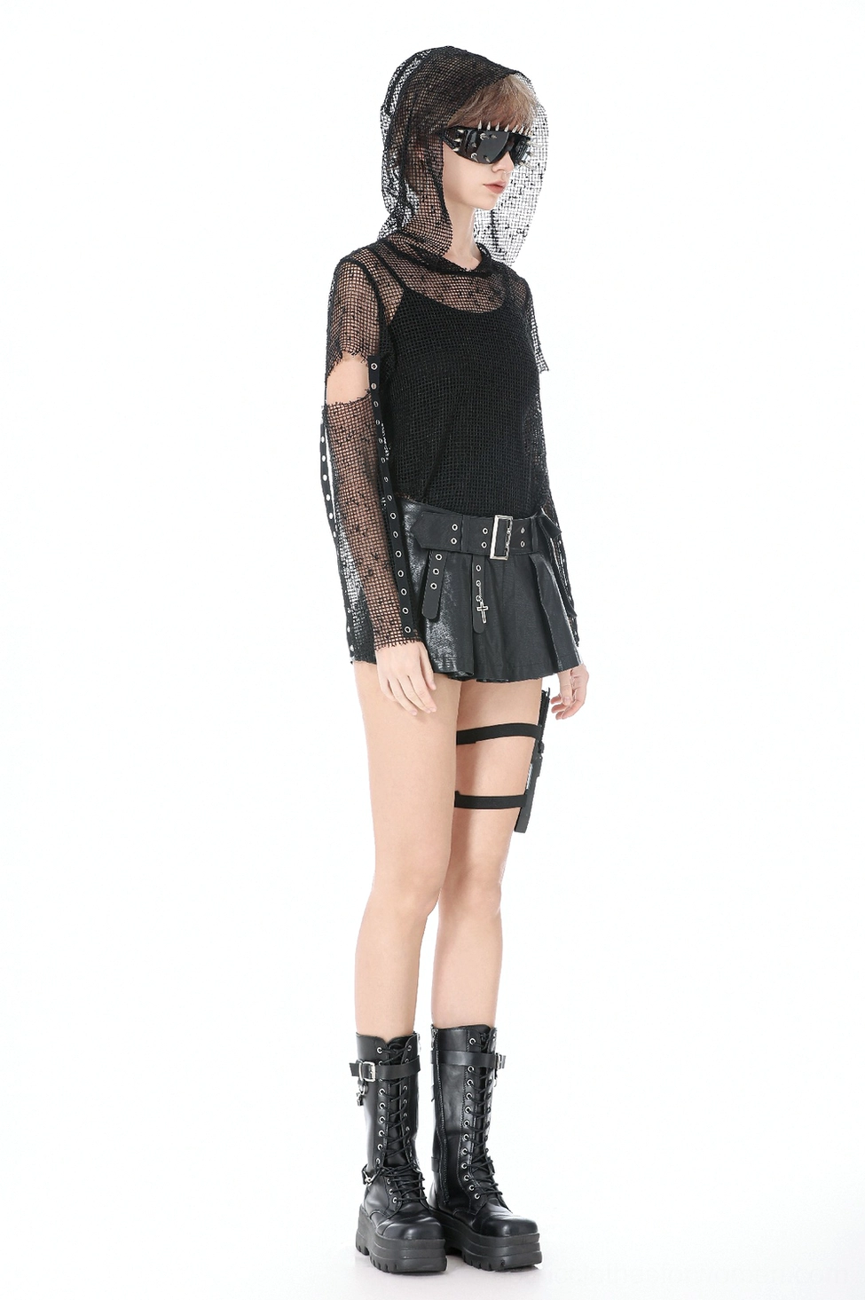 Angled view of high-waist pleated faux leather skort showcasing silhouette and architectural pleats