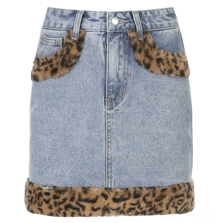 High-waist denim mini skirt flat lay front, blue wash leopard fuzzy pocket and hem trim