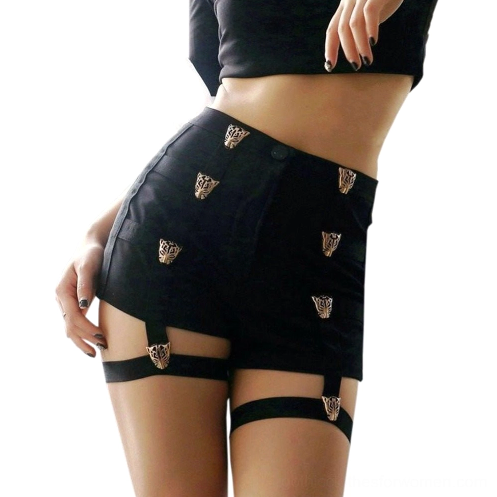 Female model wearing black high-waist shorts with metal leopard details, side rear angle studio shot