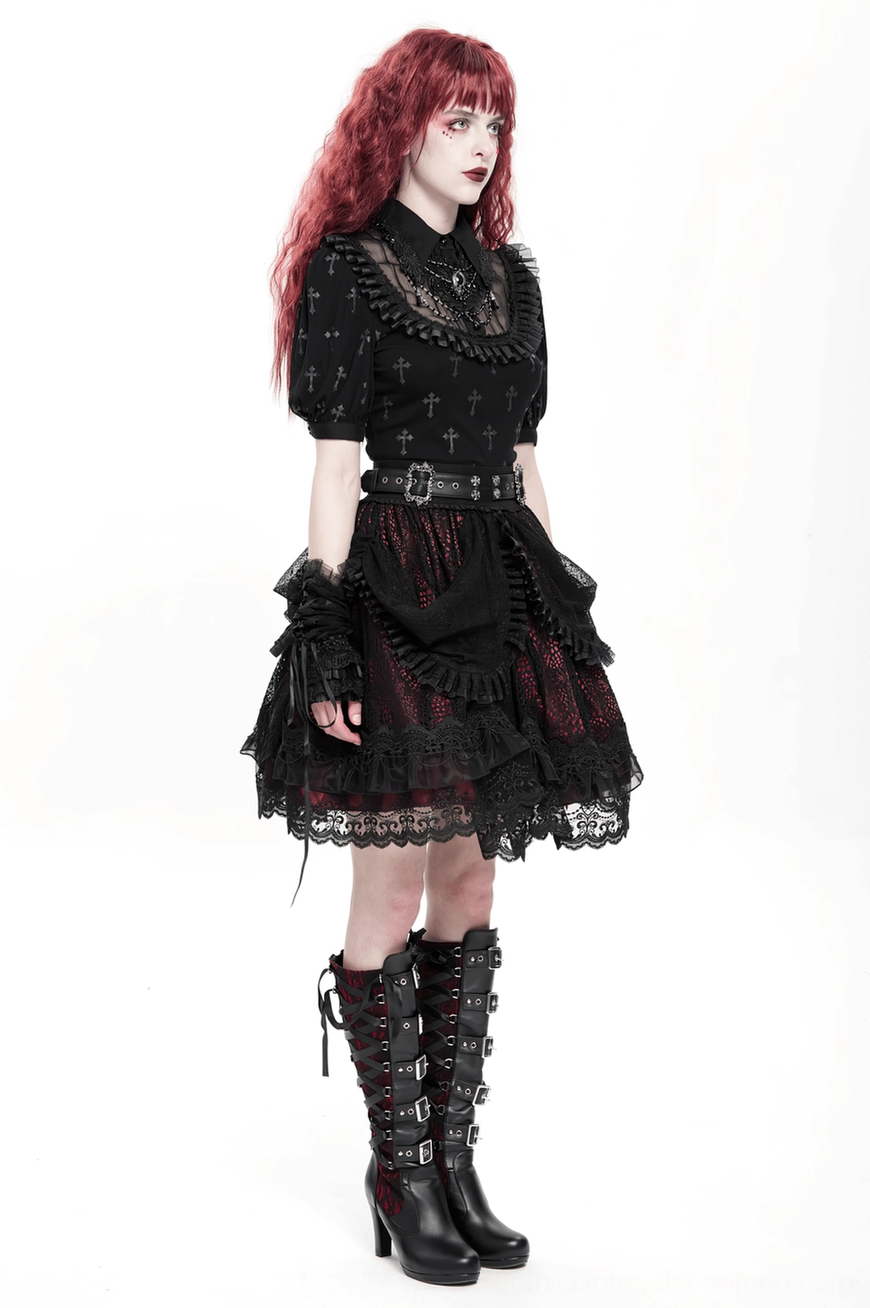 Intricate black lace overlay on gothic skirt with red contrast visible through layered ruffle design