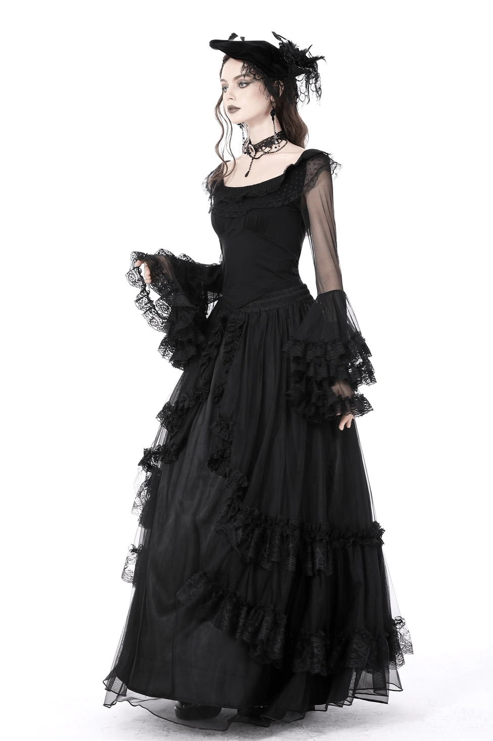 Black lace bell sleeve top worn with complementary gothic accessories and styling