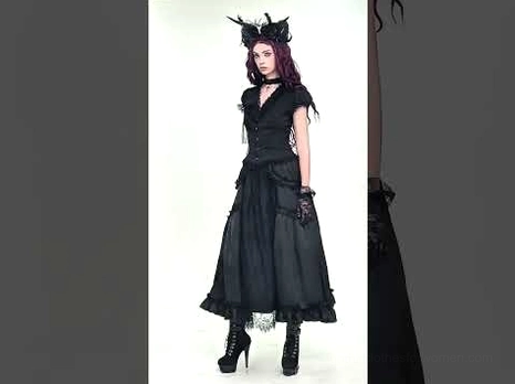 Black gothic lace maxi skirt side angle partial view highlighting sheer lace overlay and silhouette