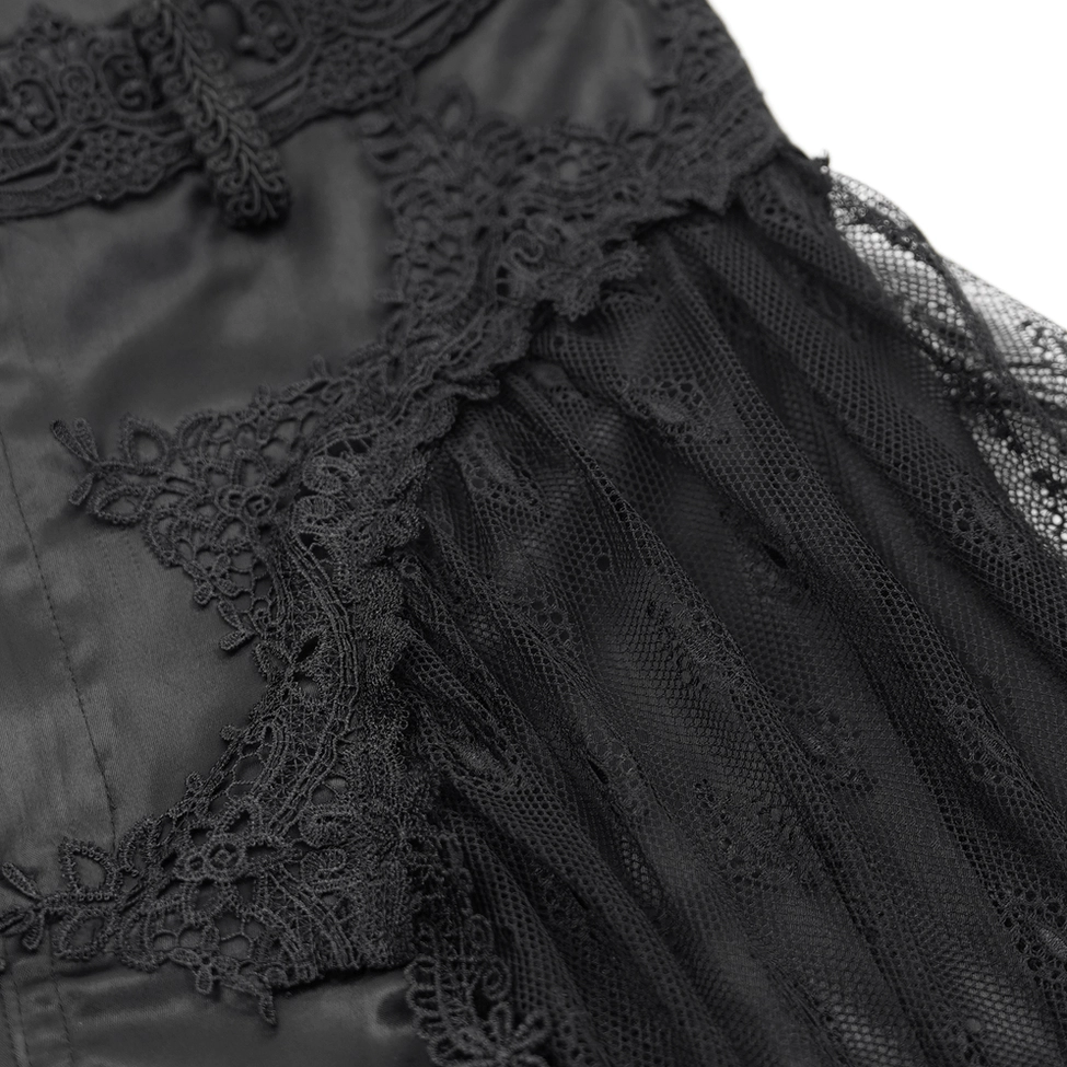 Fabric close-up showing intricate black lace mesh overlay design on satin base material of gothic pants