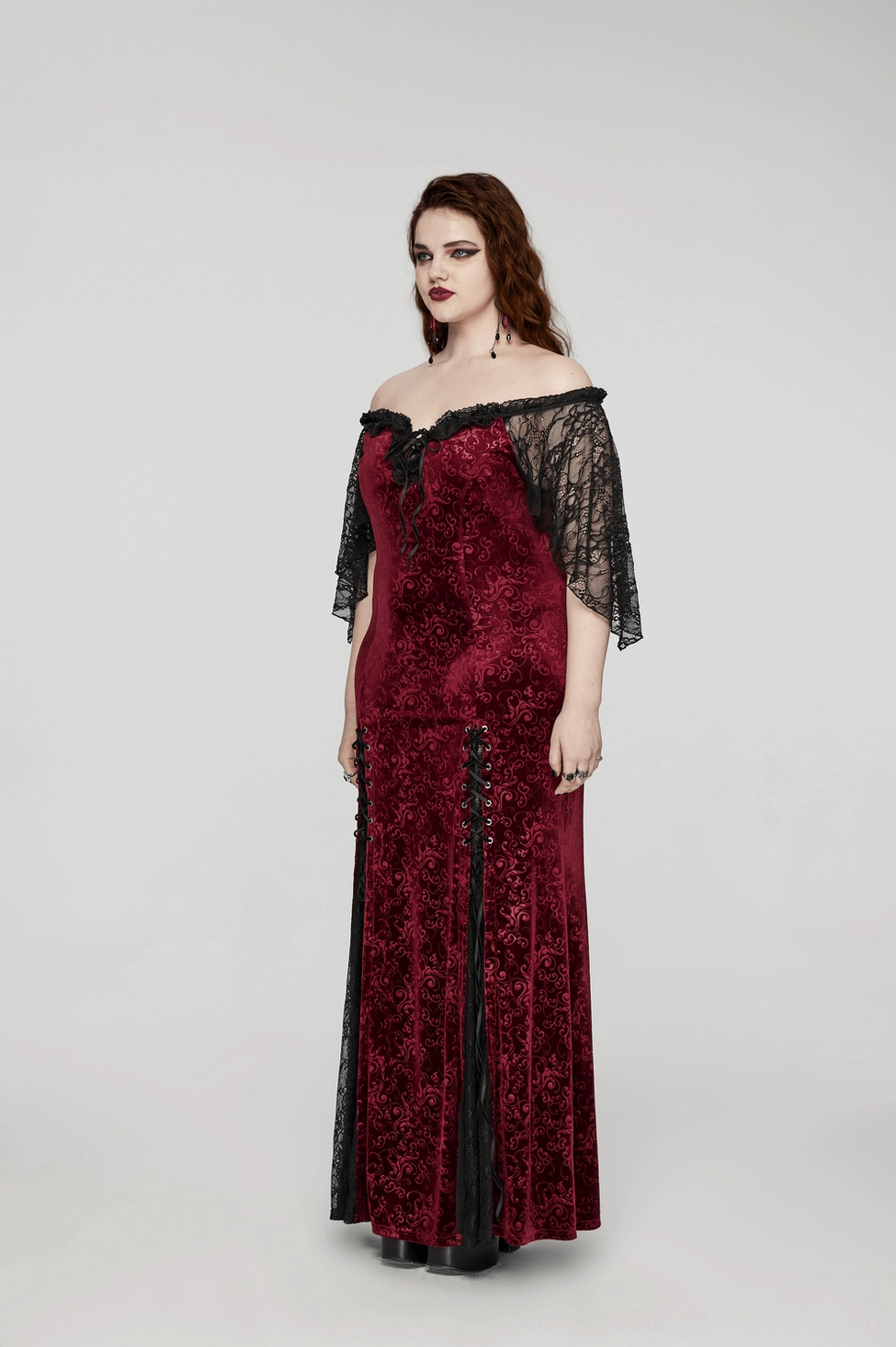 Lace patchwork hem detail of burgundy velvet gown - plum blossom eyelets and intricate gothic lace work