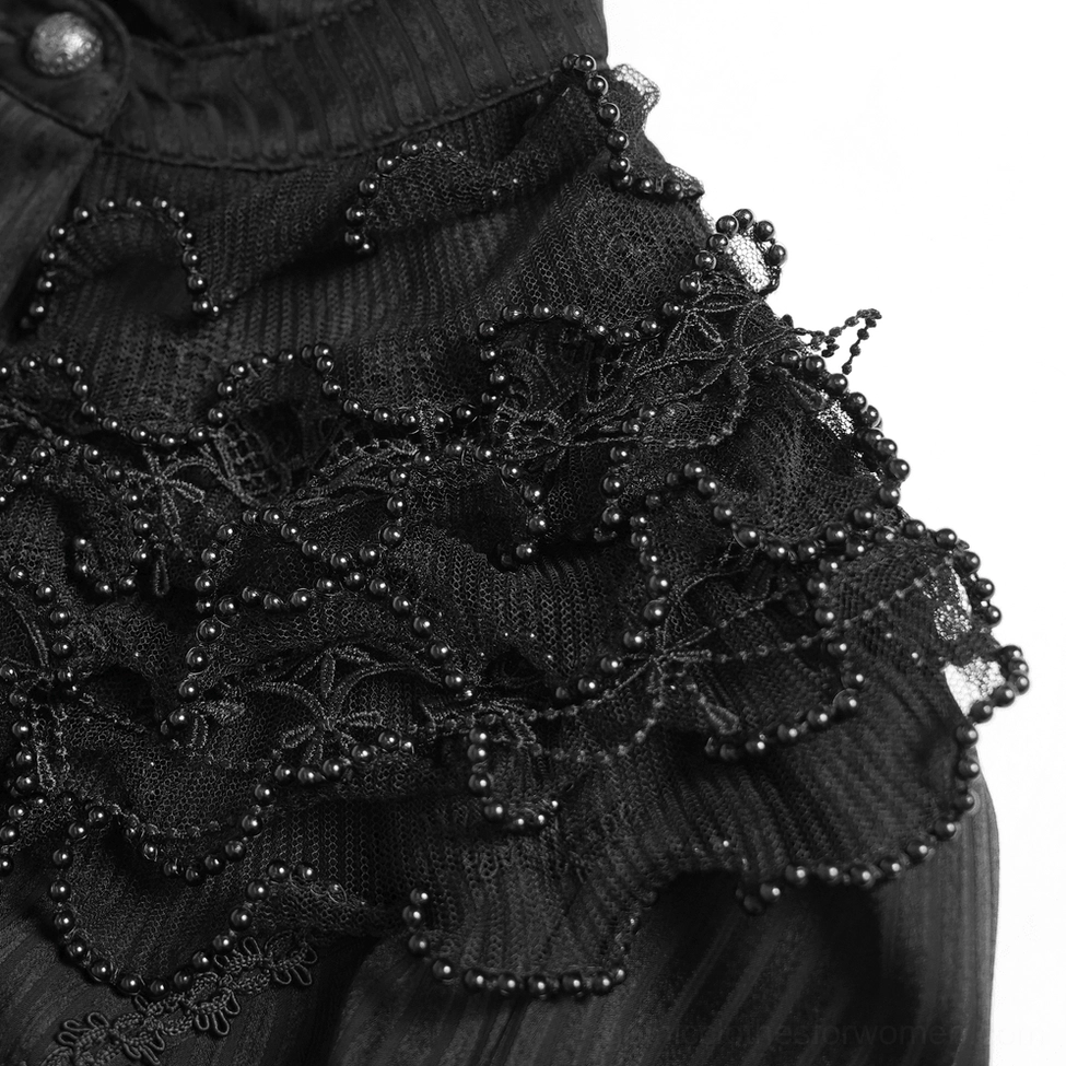 Detailed close-up of layered ruffled lace trim featuring beaded floral motifs and black bead accents