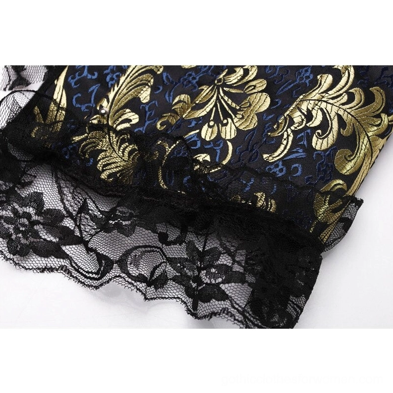Black floral lace edge trim detail on gold jacquard corset fabric close-up