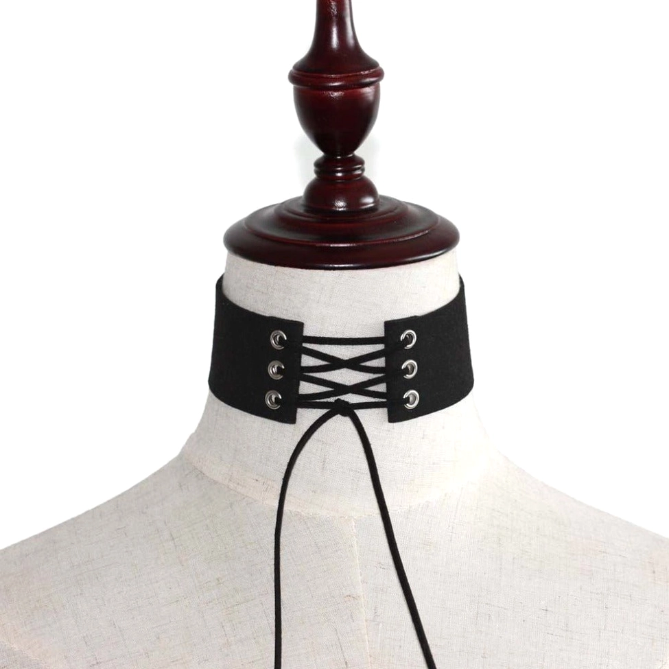 Close-up detail of lace-up velvet choker showing eyelet craftsmanship and silver hardware
