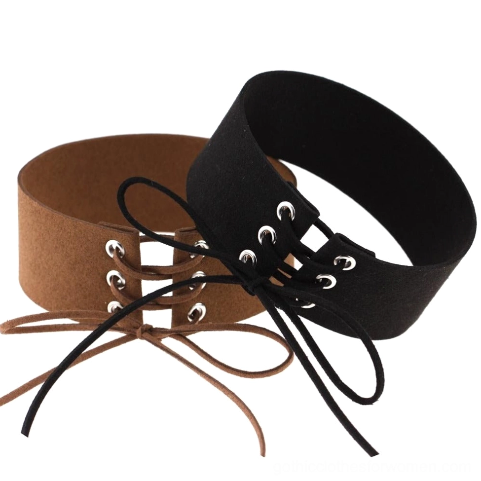 Stacked black and brown lace-up velvet chokers displaying color variety and suede texture design