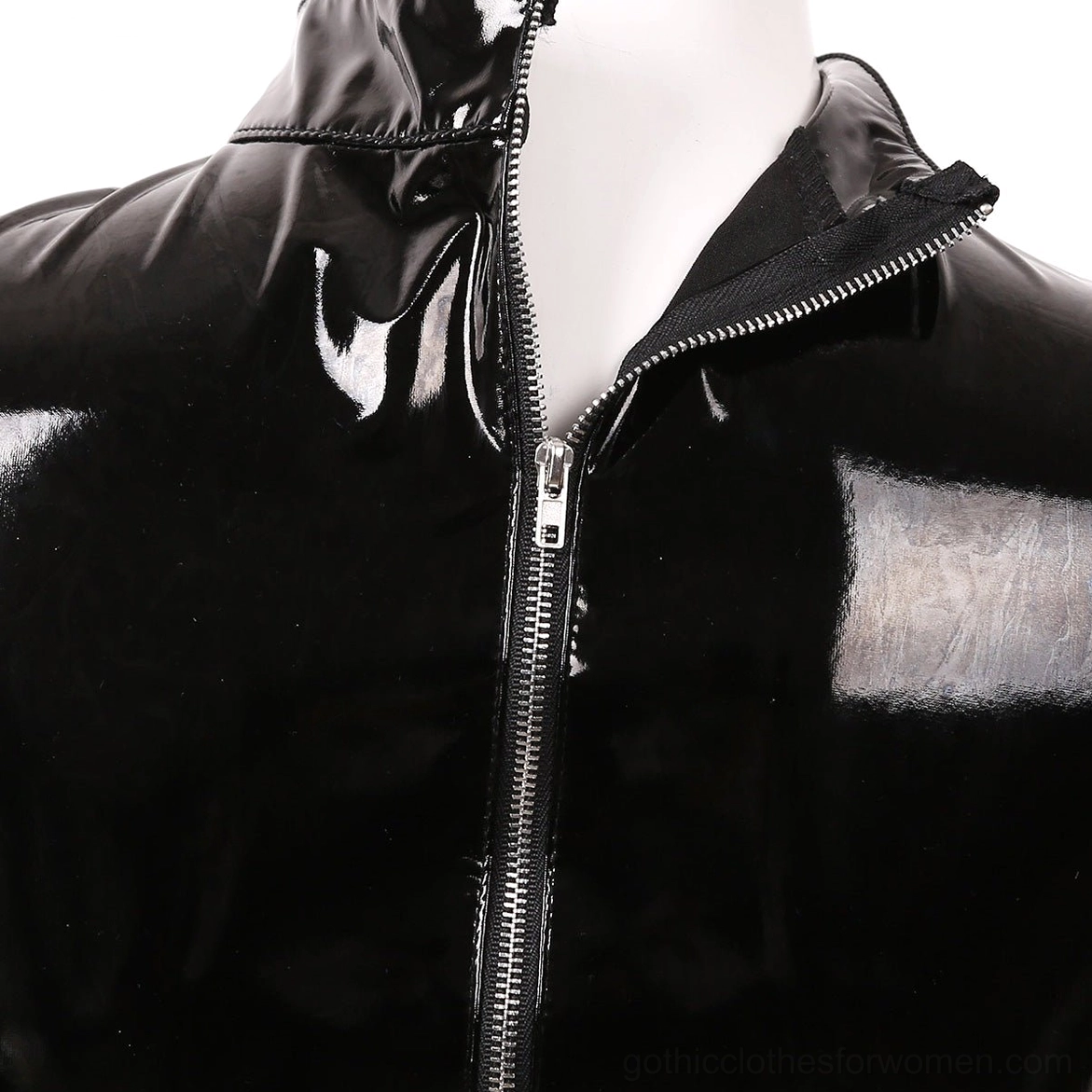 Close-up detail of metal zipper and glossy black synthetic leather fabric texture