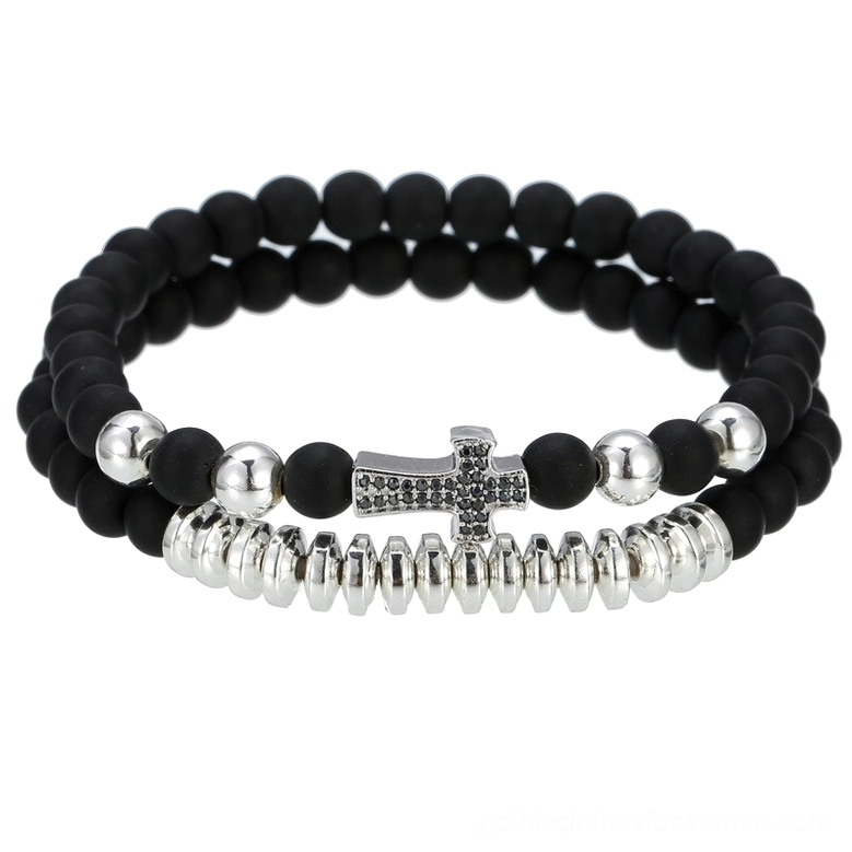 Silver lava stone cross bracelet with polished metal finish and authentic lava stone beads, toggle clasp detail