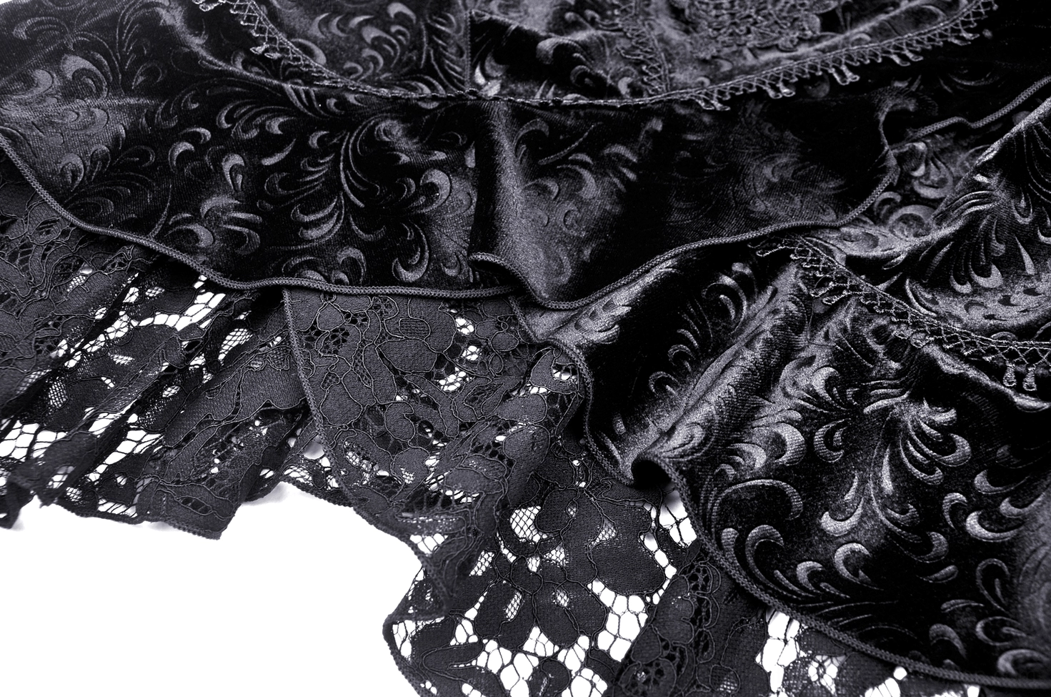 Black gothic fishtail skirt constructed with layered lace overlay and high-low asymmetrical hem styling