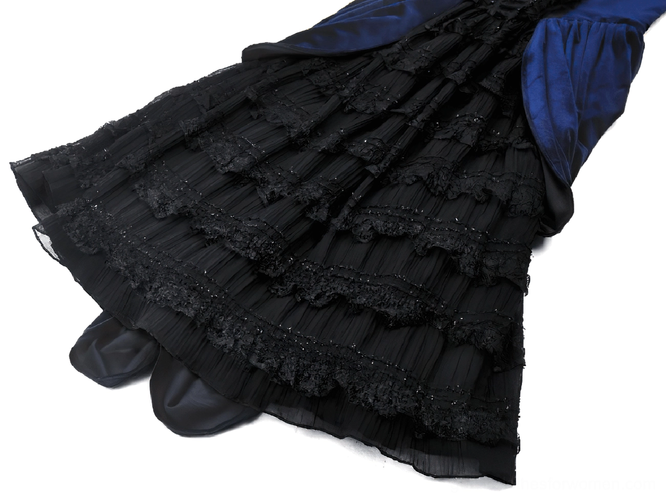 Close-up side view of multi-layered ruffled lace skirt on Gothic Lolita dress showing tulle underlayer
