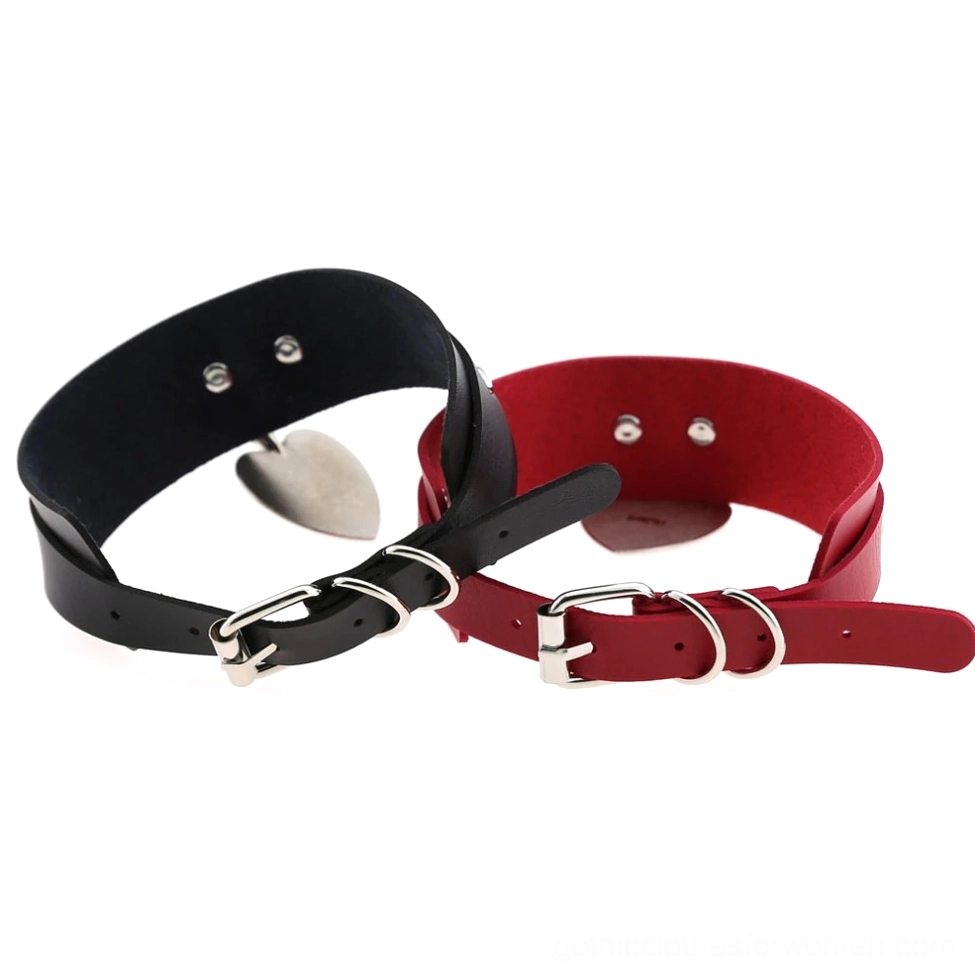 Flat lay comparison of black and burgundy leather chokers showing adjustable buckle closures and inner construction