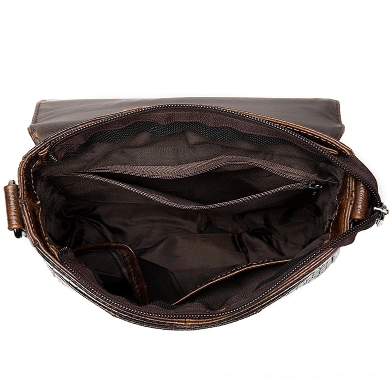 Side interior view of leather messenger bag showing divided compartments and brown fabric lining design