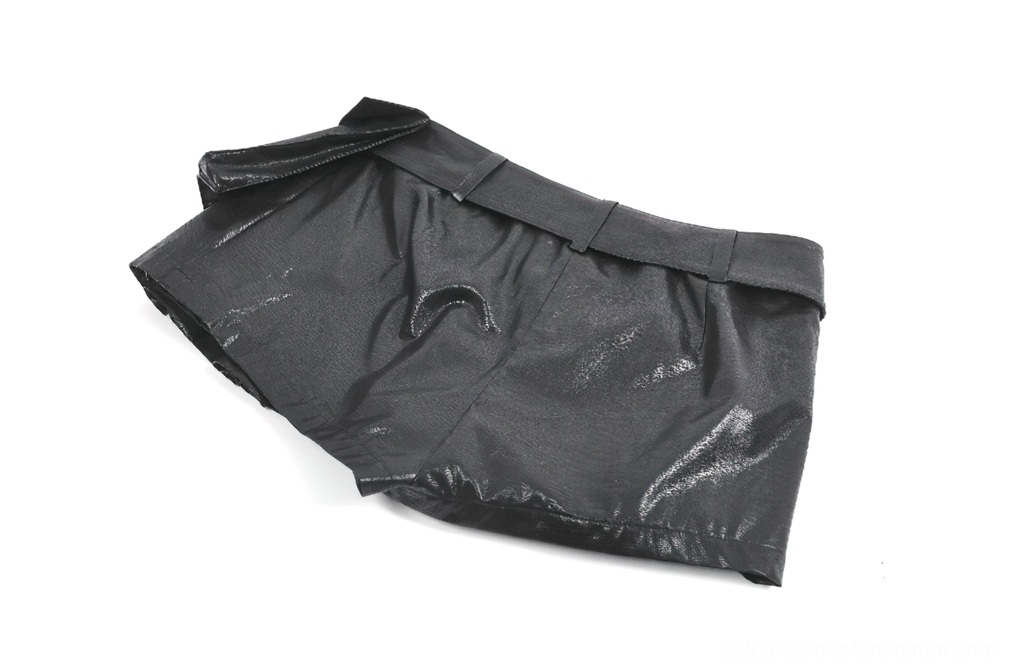 Back flat lay view of high-waisted black faux leather skort showcasing curved hem and belt construction