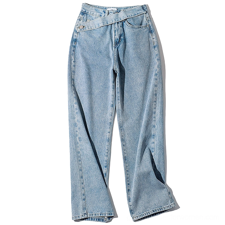 Light blue gothic denim jeans flat lay front view with asymmetric oblique waistband and zipper fly