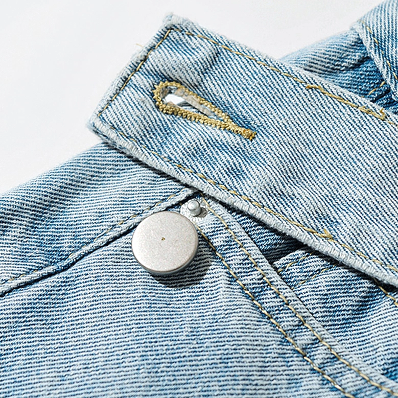 Light blue gothic denim jeans asymmetric waistband metal button with yellow topstitching detail