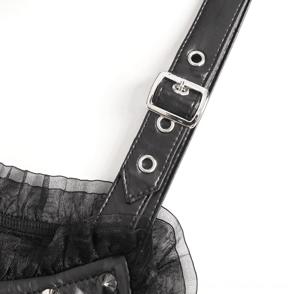 Close-up of long black glove strap hardware, metal grommet buckle and leather strap gothic hardware details