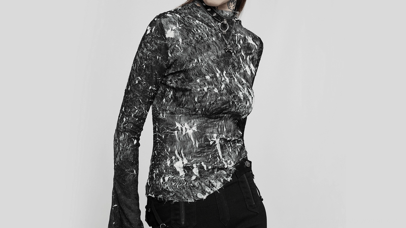 Abstract marble gothic long-sleeve fitted top featuring black base with white marble streaks asymmetric hemline and mock neck collar