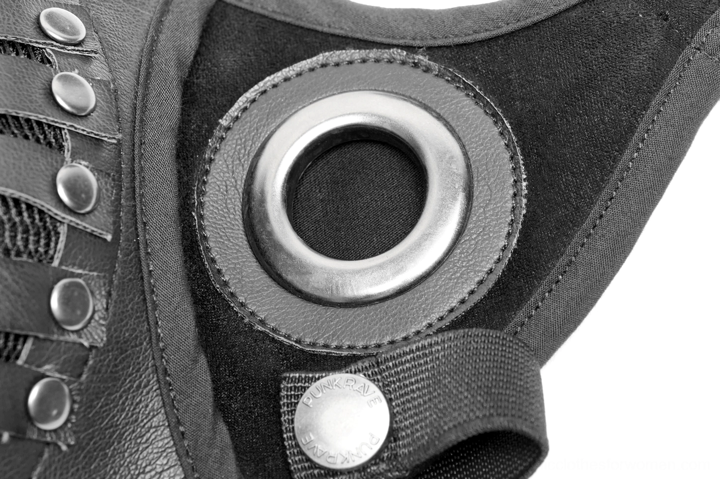 Close-up macro shot of mask side component showing metal grommet, leather texture, and rivet fasteners
