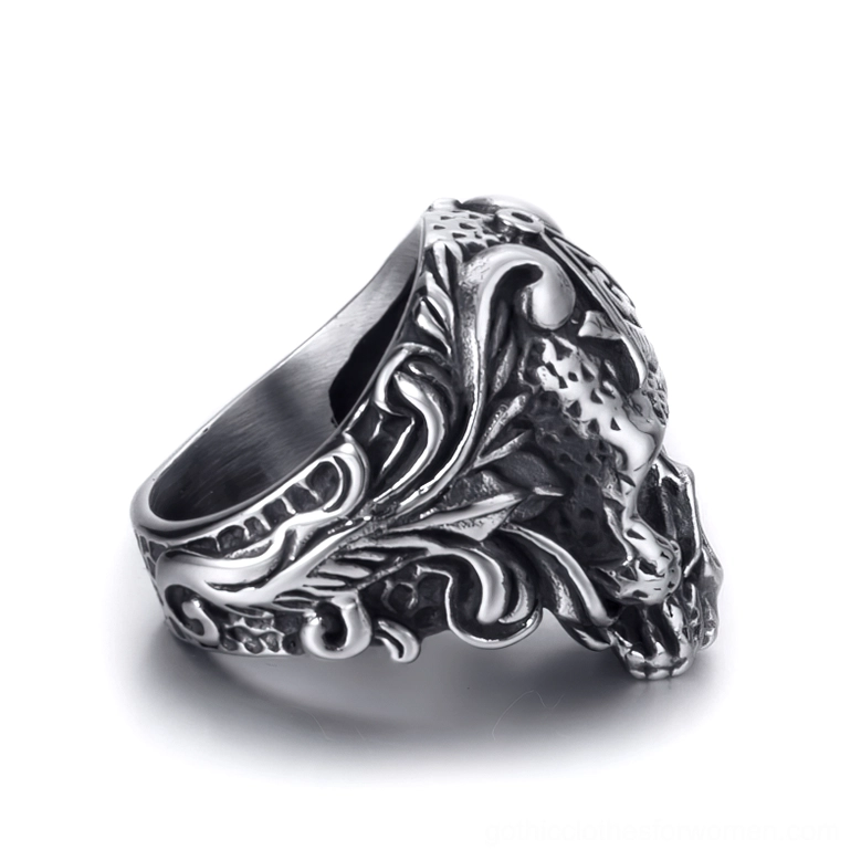 Left side view of Masonic skull ring highlighting intricate floral vine engravings and vintage silver tone finish